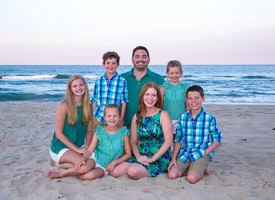 Family sitting on the beach